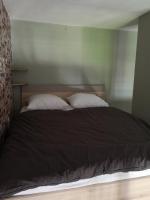 a bed with two pillows on it in a bedroom at Studio with large balcony and nice view by Weekome in Vallauris