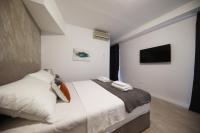 Posteľ alebo postele v izbe v ubytovaní Beachfront Apartments and Rooms