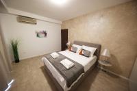 Posteľ alebo postele v izbe v ubytovaní Beachfront Apartments and Rooms