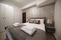 Posteľ alebo postele v izbe v ubytovaní Beachfront Apartments and Rooms