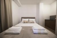 Posteľ alebo postele v izbe v ubytovaní Beachfront Apartments and Rooms