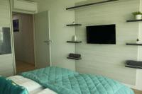 Łóżko lub łóżka w pokoju w obiekcie Suzy Apartman Siófok