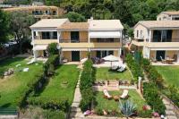 A garden outside Waves Apartments Melody Glyfada