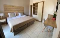 Postel nebo postele na pokoji v ubytování Megali Beach Nikos