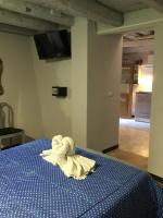 A bed or beds in a room at New Arcobaleno Ossegna
