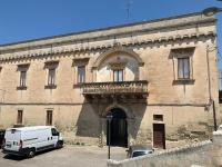 a white van parked in front of a building at Palazzo Moschettini in Martano