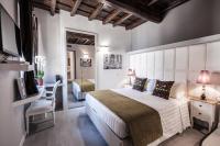 Corso Suite 107 Rooms Wellness & Spaにあるベッド