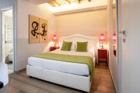 Corso Suite 107 Rooms Wellness & Spaにあるベッド