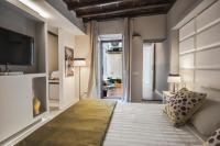 Corso Suite 107 Rooms Wellness & Spaにあるベッド