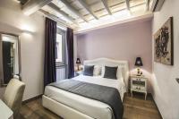 Corso Suite 107 Rooms Wellness & Spaにあるベッド