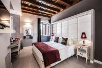 Corso Suite 107 Rooms Wellness & Spaにあるベッド