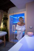Corso Suite 107 Rooms Wellness & Spaにあるベッド