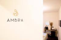 Televízia a/alebo spoločenská miestnosť v ubytovaní Bellevue - Rooms & Suites