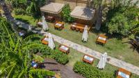 A garden outside La Brezza Suite & Hotel
