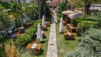 A garden outside La Brezza Suite & Hotel