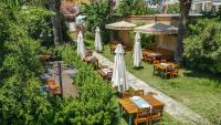 A garden outside La Brezza Suite & Hotel