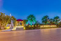 A garden outside La Brezza Suite & Hotel