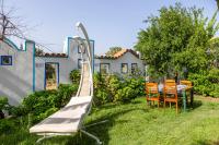 A garden outside La Brezza Suite & Hotel