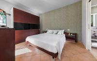 A bed or beds in a room at Residence Poggio Dei Pini
