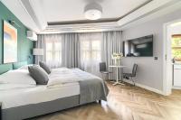 Łóżko lub łóżka w pokoju w obiekcie City Apartments - Apartamenty Butikowe