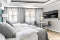 Łóżko lub łóżka w pokoju w obiekcie City Apartments - Apartamenty Butikowe