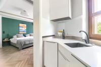 Łóżko lub łóżka w pokoju w obiekcie City Apartments - Apartamenty Butikowe