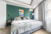 Łóżko lub łóżka w pokoju w obiekcie City Apartments - Apartamenty Butikowe