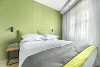 Łóżko lub łóżka w pokoju w obiekcie City Apartments - Apartamenty Butikowe