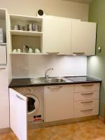 A kitchen or kitchenette at Residence Poggio Dei Pini