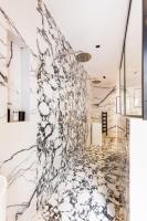 a lobby with a large marble wall at CMG BASTILLE &#47; GARE DE LYON 2 in Paris
