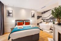 a bedroom with a large bed and a bath tub at CMG BASTILLE &#47; GARE DE LYON 2 in Paris