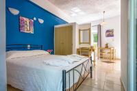 Posteľ alebo postele v izbe v ubytovaní Stavros Villas&Apartments
