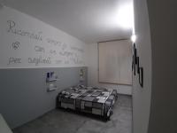A bed or beds in a room at CASA ALEXSA Intero appartamento o CAMERA ALEXSA Camera matrimoniale con patio
