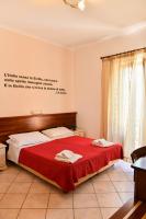 Łóżko lub łóżka w pokoju w obiekcie Mamamia #Lipari