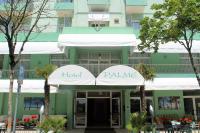 a hotel palaise in front of a building at Hotel Palme Park &amp; Beach included in Lido di Jesolo