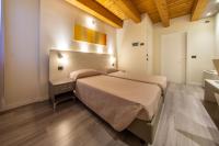 Posteľ alebo postele v izbe v ubytovaní Hotel Regio