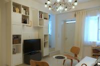Televízia a/alebo spoločenská miestnosť v ubytovaní White cycladic town house with sea vew