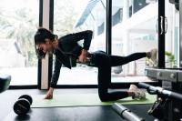 a woman doing a push up in a gym at Sarikantang Resort & Spa, Koh Phangan in Haad Rin