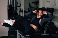 a woman laying on a chair in a gym at Sarikantang Resort & Spa, Koh Phangan in Haad Rin