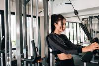a woman is in a gym with an umbrella at Sarikantang Resort & Spa, Koh Phangan in Haad Rin