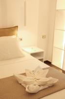 Postel nebo postele na pokoji v ubytování Polymnia Luxury Apartments Argostoli