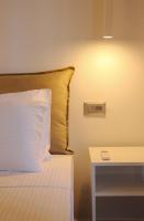 Postel nebo postele na pokoji v ubytování Polymnia Luxury Apartments Argostoli