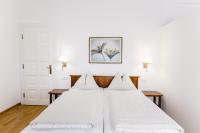 Łóżko lub łóżka w pokoju w obiekcie Seehotel Billroth