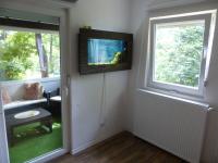 Televízia a/alebo spoločenská miestnosť v ubytovaní House Plitvice