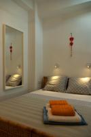 Posteľ alebo postele v izbe v ubytovaní White cycladic town house with sea vew