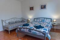 Postel nebo postele na pokoji v ubytování Apartman Maria