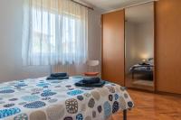 Postel nebo postele na pokoji v ubytování Apartman Maria