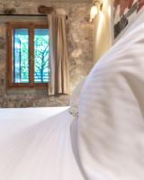 Łóżko lub łóżka w pokoju w obiekcie Boutique Stone Cottage