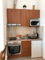 Cuisine ou kitchenette dans l&#39;&eacute;tablissement Apartments Delfini