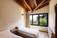 A bed or beds in a room at Apartamentos Masella 1600